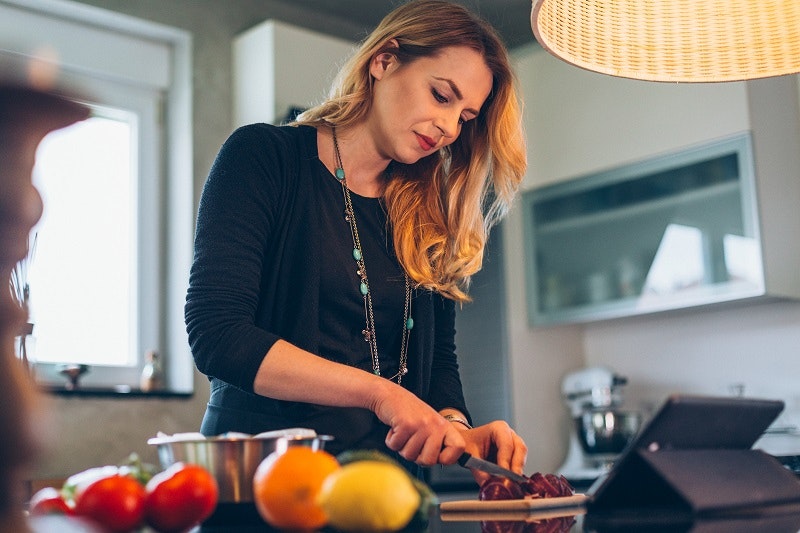 Young woman preparing healthy meal